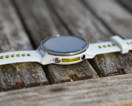 The side of the Garmin Forerunner 970 showing two buttons and a Forerunner badge.