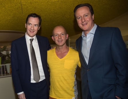 Osborne, Hilton and David Cameron stand together in a row. Hilton is wearing a yellow T-shirt; Osbourne and Cameron are wearing suits