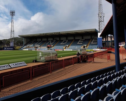 Dens Park, viewed from the Grandstand, a peculiar V-shaped main stand in Dundee that angles away from the pitch.