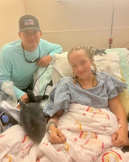 Addison Bethea in Tallahassee hospital with her brother Rhett, and cuddly shark toy.