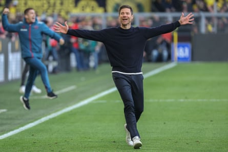 Leverkusen manager Xabi Alonso runs down the touchline at Dortmund after Josip Stanisic’s late equaliser.