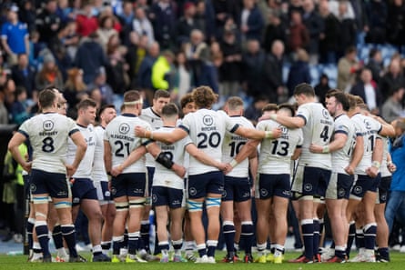Scotland's players huddle together after the final whistle