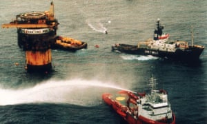 Greenpeace campaigners clash with Shell workers in a battle to stop the Brent Spar oil installation from being dumped into the North Sea in the 1990s