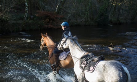 Horse Rider at Tarr Steps, in Autumn, Exmoor National Park, UK