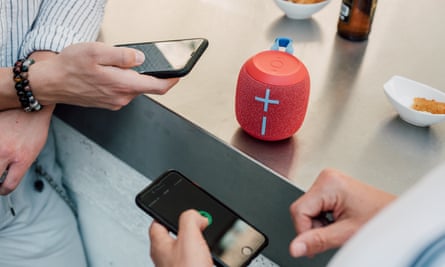 Multiple people with phones streaming music to Ultimate Ears Wonderboom 2 speakers