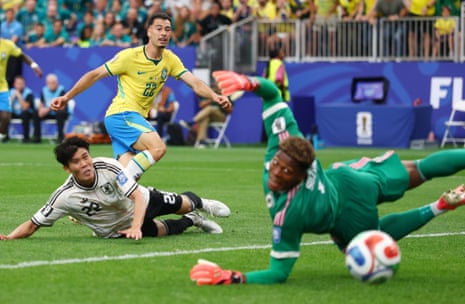 Gabriel Martinelli scores the winning goal past goalkeeper Zion Suzuki and Takehiro Tomiyasu