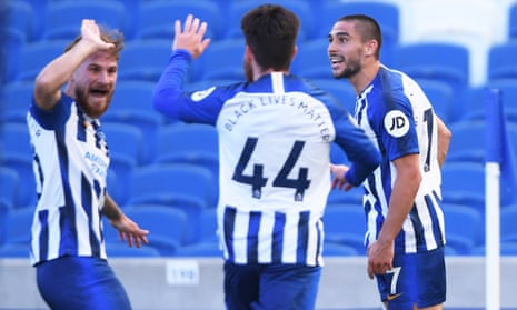 Brighton &amp; Hove Albion’s Neal Maupay (right) celebrates scoring their second goal with teammates .