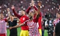 Ayoub El Kaabi and his Olympiakos teammates celebrate their Europa Conference League semi-final victory over Aston Villa in Piraeus.