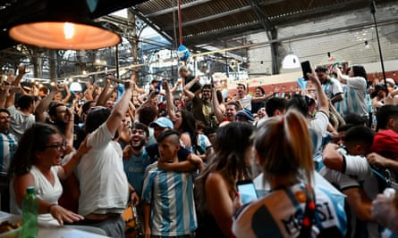 Fans watching the match at a market in Buenos Aires
