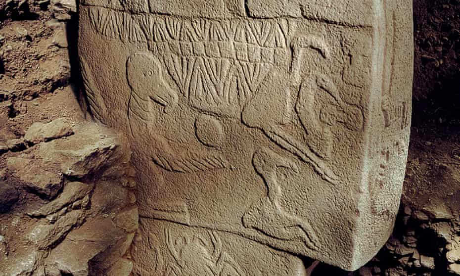 A carving found on a pillar at Göbekli Tepe, apparently showing a figurine holding a head.