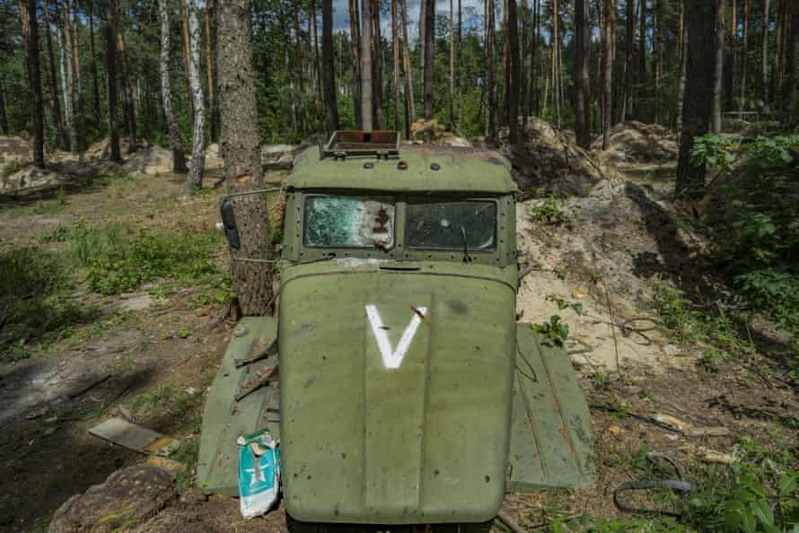 The abandoned remains of a Russian truck cabin with the V symbol in the forests around Kyiv.