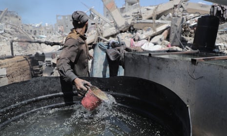 A man processes waste plastic to produce fuel due to the fuel crisis in Gaza.