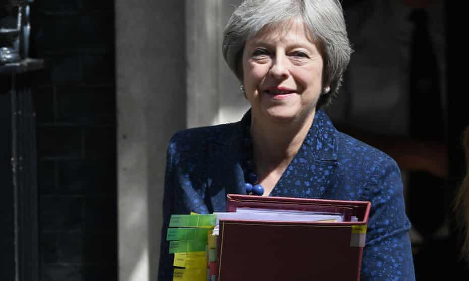 Theresa May leaves 10 Downing Street for the House of Commons