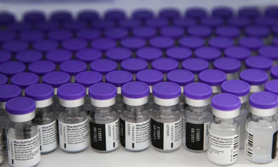 Vials containing Pfizer and BioNTech Covid-19 vaccine stored in a fridge at a vaccination centre in London.