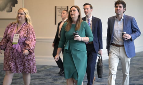 Arkansas Governor-elect Sarah Huckabee Sanders, center, walks through the Republican Governors Association conference in November in Orlando.