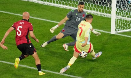 Albania's goalkeeper Thomas Strakosha saves a shot by Spain's Álvaro Morata.