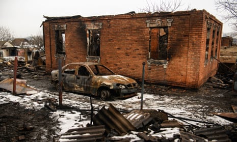 Houses and cars destroyed in a fire following an attack by Russia’s Shahed drones in Kharkiv, Ukraine, on 12 February 2024.
