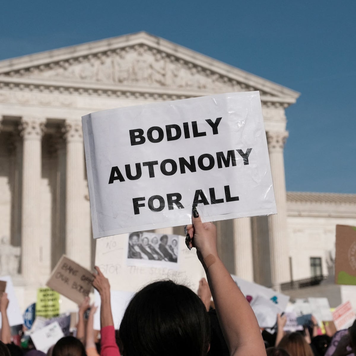 Tears and tension as protesters swarm outside US supreme court | Roe v Wade | The Guardian