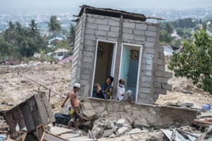 Palu, IndonesiaPeople rest in what was a toilet block in an area that was completely destroyed by the earthquake. The death toll from last weeks earthquake and tsunami has risen to at least 1,400 with time running out to rescue survivors six days after the disaster struck