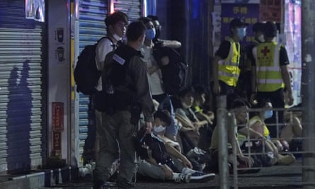 Police arrest anti-government protesters in Hong Kong early on Monday 11 May.