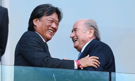 Costa Rica football president Eduardo Li shakes hands with Fifa president Sepp Blatter before kickoff at a 2014 World Cup match.