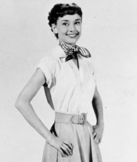 Audrey Hepburn in white shirt and skirt and necktie
