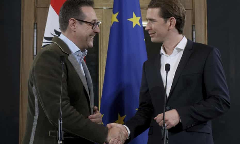 Heinz-Christian Strache, left, shakes on the deal with Sebastian Kurz in Vienna, Austria, on Friday. 