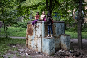 Amina says goodbye to her friends before being collected with her mother Iryna, from their home in Druzhkivka, Ukraine as border towns are evacuated.