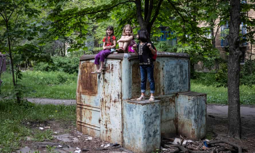 Amina, 9, says goodbye to her friends she and her mother leave their home in Druzhkivka, Ukraine