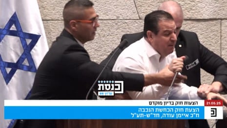 Israeli opposition MP forcefully removed from podium after condemning Gaza war – video
