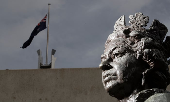 The Australian flag flies at half mast in front of a statue of Queen Elizabeth II at Parliament House in Canberra. The flag should be flown at half mast until after the day of the funeral in the UK.