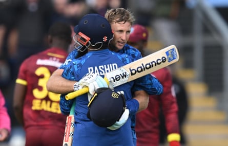 Root embraces Adil Rashid after scoring the winning runs against West Indies