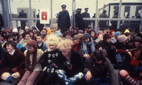 Women anti-nuclear protestors, who had camped outside the gates of Greenham Common Air base in southern England for the past 26 months, found themselves once more doing battle with local police as they continued their protests aggainst the arrival of further air deliveries of Europe's first Cruise missiles, on Nov. 15, 1983. Many arrests were made as the women staged their blockade of the main gates. (AP Photo/Dave Caulkin)