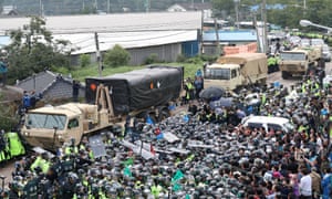 A set of four rocket launchers, part of the THAAD (Terminal High Altitude Area Defense) system arrives in Seongju, 300km south of Seoul, in South Korea on Thursday.