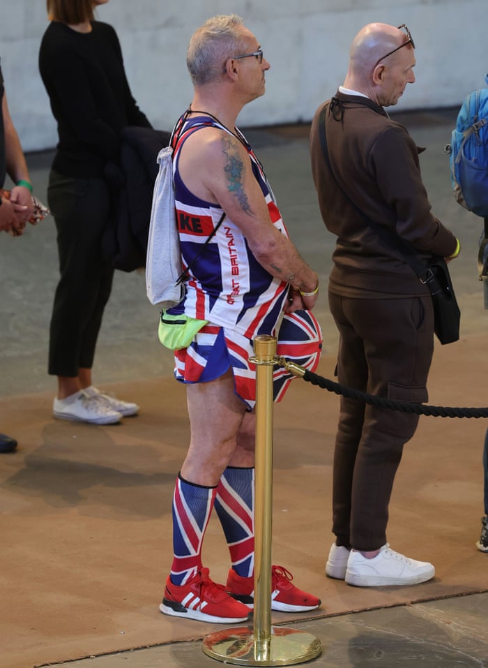 A member of the public wearing a union jack outfit waits in line inside Westminster Hall on Saturday.