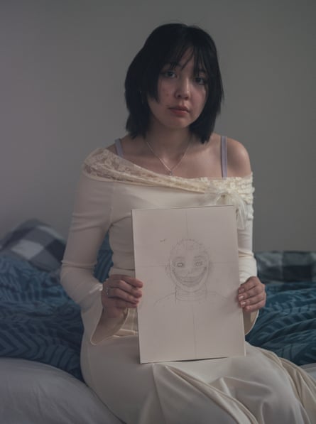 Keira’s older daughter, Zoe, pictured with a drawing of one of her hallucinations