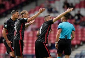 Croatia’s Dejan Lovren and teammates remonstrate with referee.