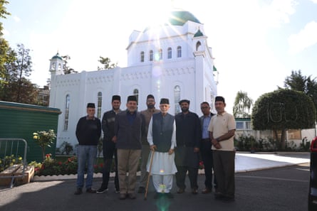 People stand outside the mosque