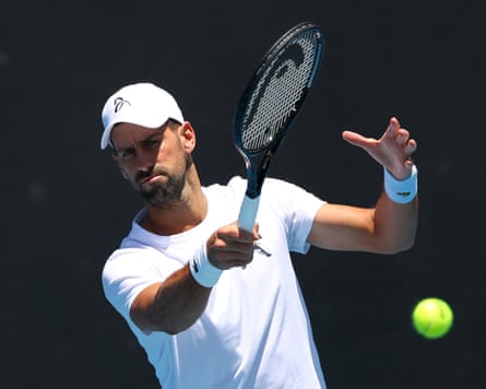 Novak Djokovic plays a forehand during a practice session