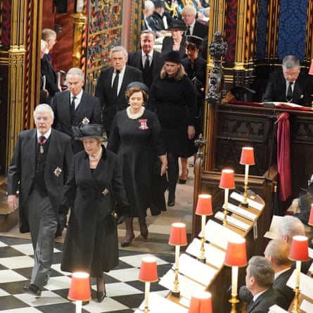 Former prime ministers (left to right, from front) John Major and his wife, Norma Major; Tony Blair and his wife, Cherie Blair; Gordon Brown and his wife, Sarah Brown; David Cameron and his wife, Samantha Cameron; and Theresa May and Boris Johnson visible in the rear.