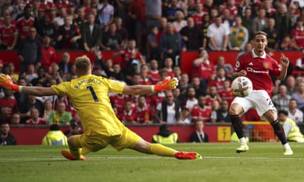 Manchester United's Antony, right, scores the opening goal in the victory against Arsenal.