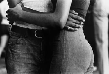 From Series: South Bronx, 1977Rather than photographing the poverty and violence that exist in the South Bronx, Barrat highlights the beauty of its residents, the l;ove that unites couples and the joy of children playing and finding relief from the heat on sweltering days in sytreets that are often dilapidated. In this way, she continues her project of highlighting the gap between the beauty and intelligence of the South Bronx residents and the delapidated environment in which they survive.
