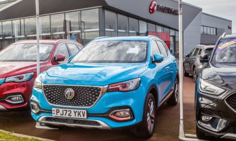 A MG ZS EV Trophy electric car for sale on a dealer’s forecourt