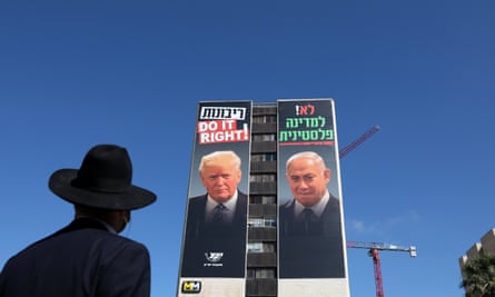 a billboard showing Israeli Prime Minister Benjamin Netanyahu (R) and US President Donald Trump (L)
