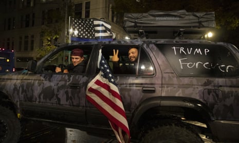 Supporters of President Donald Trump drive Saturday, Nov. 7, 2020, in Portland, Ore.