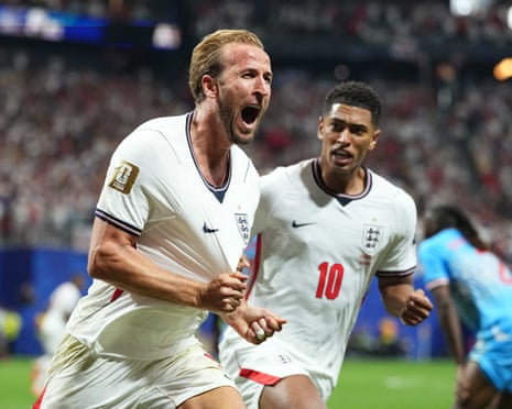 Harry Kane and Jude Bellingham celebrate England's equaliser.