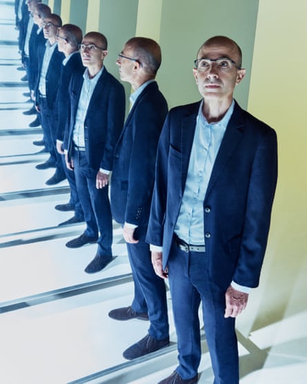 Yuval Noah Harari photographed with mirrors that give the impression there are multiple versions of him