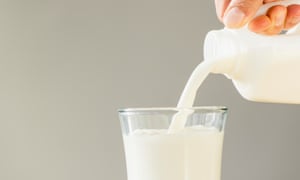 Hand pouring milk