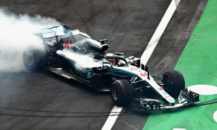Lewis Hamilton celebrates securing his fifth Formula One world title, at the Mexico Grand Prix.