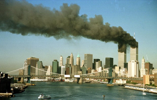 The towers of the World Trade Center pour smoke shortly after being struck by hijacked commercial airplanes in New York on September 11, 2001.